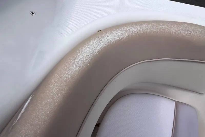 Slide: The Image of Close-up of 2008 Scout 222 Dorado boat seating with beige and white upholstery. - 37