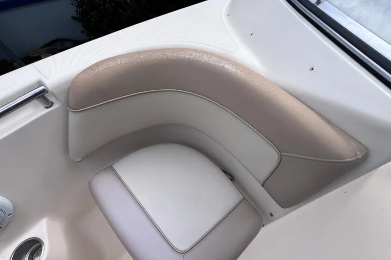 Slide: The Image of 2008 Scout 222 Dorado boat interior with beige and white cushioned seating. - 39