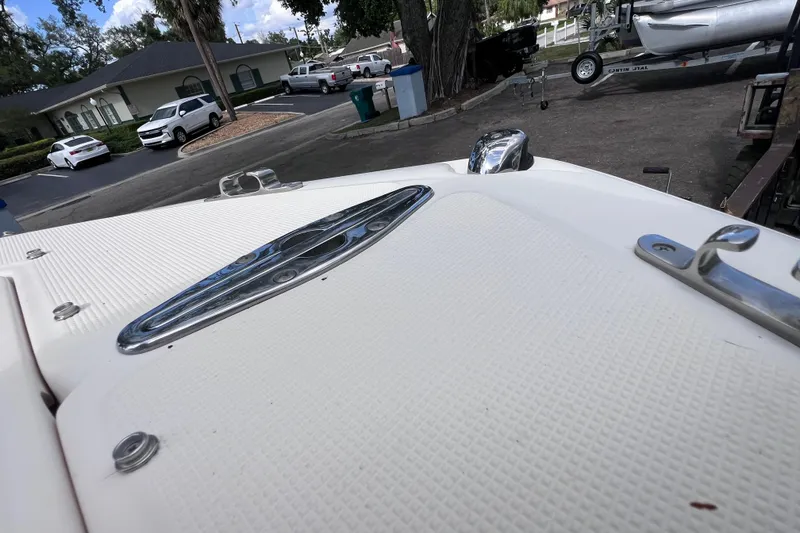 Slide: The Image of 2008 Scout 222 Dorado boat deck with chrome fittings in a parking area. - 41