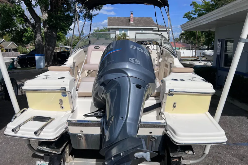Slide: The Image of 2008 Scout 222 Dorado boat with Yamaha 200 engine, parked outdoors. - 5