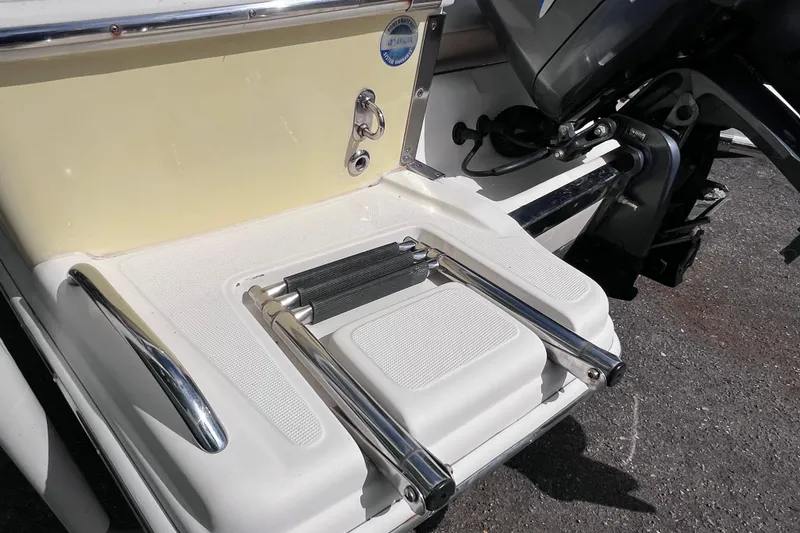 Slide: The Image of 2008 Scout 222 Dorado boat swim platform with foldable ladder and chrome details. - 7