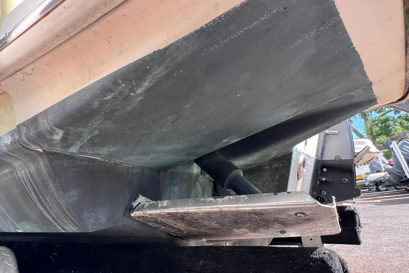 Slide: The Image of Underside view of a 2008 Scout 222 Dorado boat hull in a marina. - 8