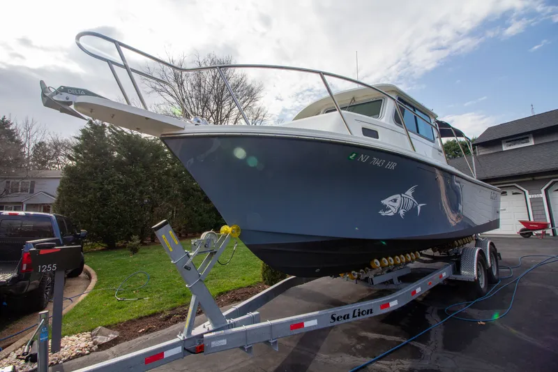 Slide: The Image of Parker 2520 XLD Sport Cabin 2022 on trailer outdoors. - 1