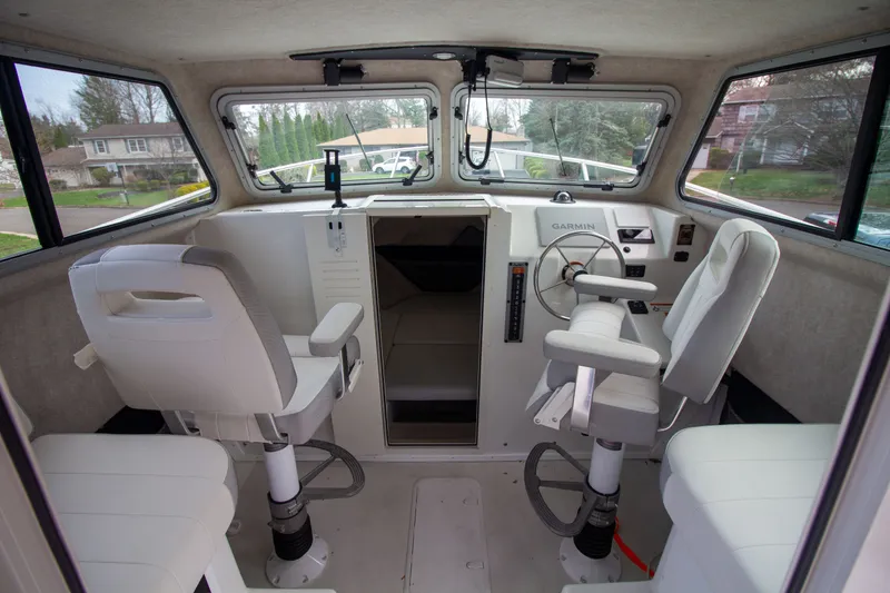 Slide: The Image of Interior of 2022 Parker 2520 XLD Sport Cabin with helm console. - 25