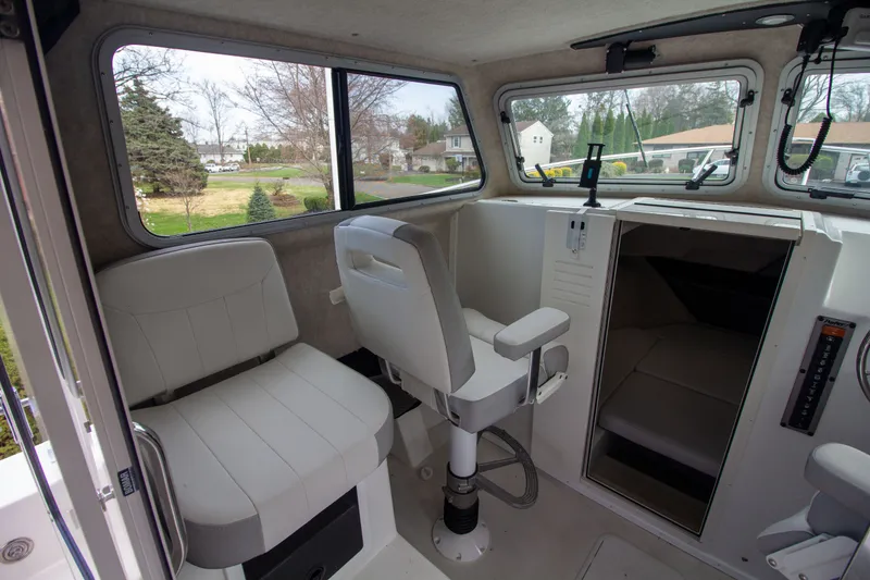 Slide: The Image of Interior of 2022 Parker 2520 XLD Sport Cabin with seating. - 27