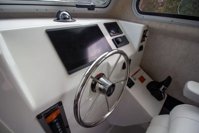 Slide: The Image of Interior view of Parker 2520 XLD Sport Cabin 2022 helm. - 29