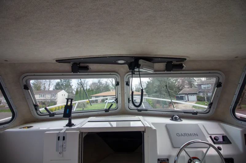 Slide: The Image of Interior view of 2022 Parker 2520 XLD Sport Cabin with Garmin controls. - 30