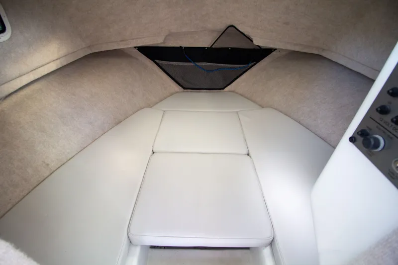Slide: The Image of Interior of 2022 Parker 2520 XLD Sport Cabin with cushioned seating. - 32