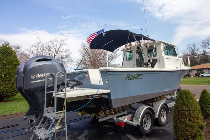 Slide: The Image of Parker 2520 XLD Sport Cabin 2022 on trailer with Yamaha engine. - 4