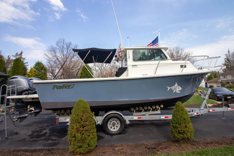 Slide: The Image of 2022 Parker 2520 XLD Sport Cabin on trailer outdoors. - 5