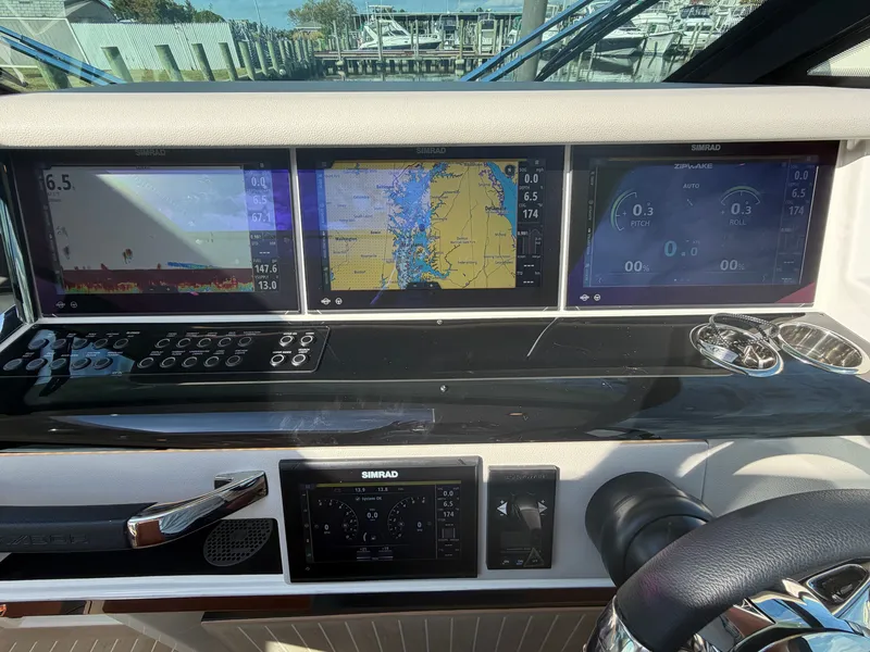 Slide: The Image of The image shows the cockpit of a Saxdor 400 GTC with modern navigation screens and controls. - 22