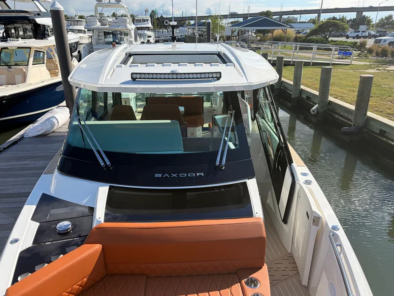 Slide: The Image of 2027 Saxdor 400 GTC at the dock with sleek design and spacious cockpit. - 30