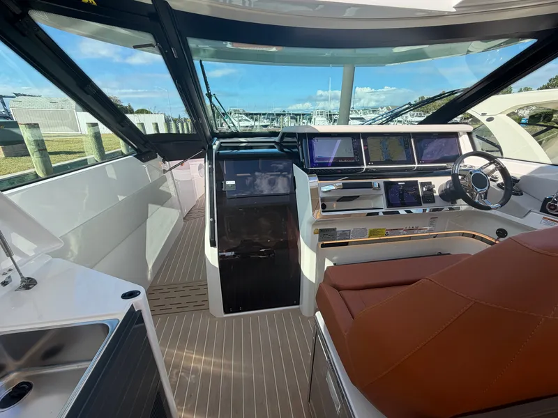 Slide: The Image of The 2027 Saxdor 400 GTC cockpit features modern instruments and sleek design. - 19