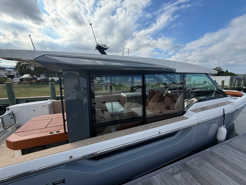 Slide: The Image of The 2027 Saxdor 400 GTC is docked. It features a modern design with large windows. - 8