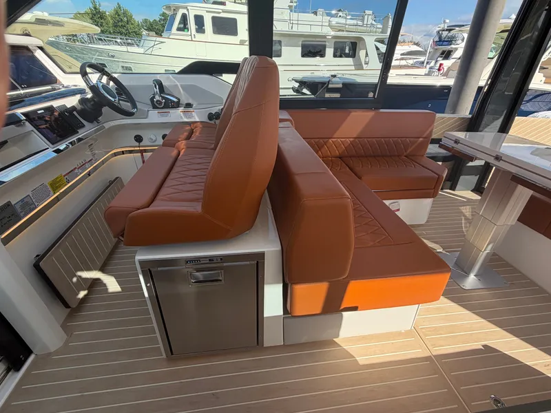 Slide: The Image of The image shows the interior of a Saxdor 400 GTC with brown leather seating and a modern helm. - 18