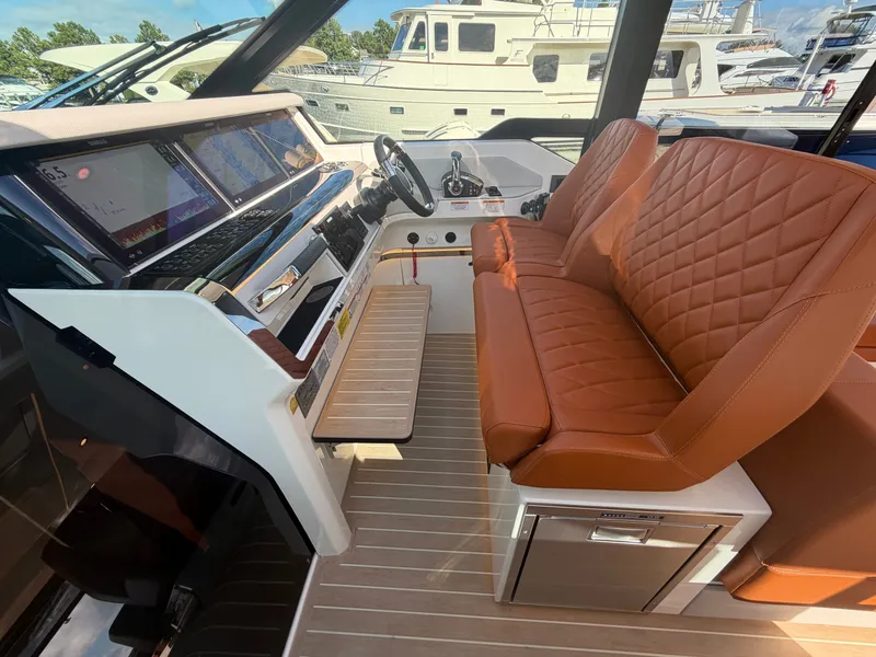 Slide: The Image of The image shows the cockpit of a Saxdor 400 GTC with brown leather seats and a modern dashboard. - 20