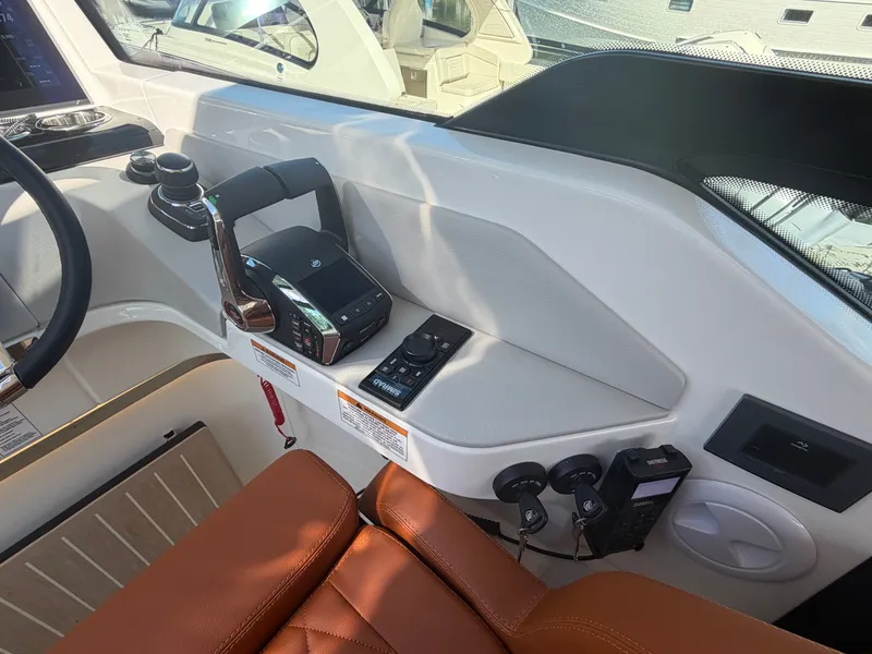 Slide: The Image of The image shows the cockpit of a 2027 Saxdor 400 GTC with modern controls and brown leather seats. - 23