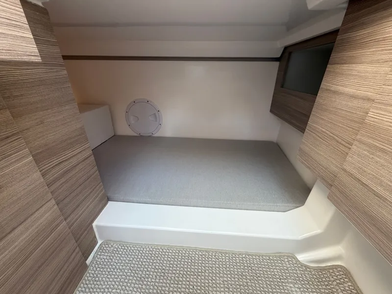 Slide: The Image of Interior of a 2027 Saxdor 400 GTC with modern wood decor and cushioned sleeping area. - 42