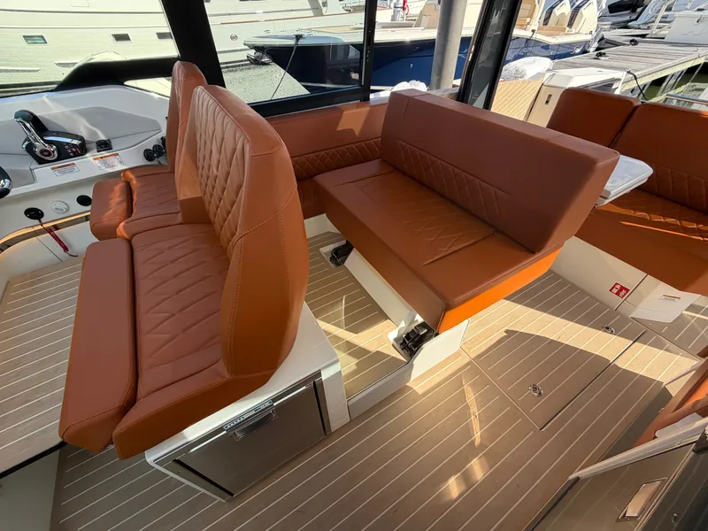 Slide: The Image of The image shows the interior of a Saxdor 400 GTC with brown leather seats and wooden flooring. - 16