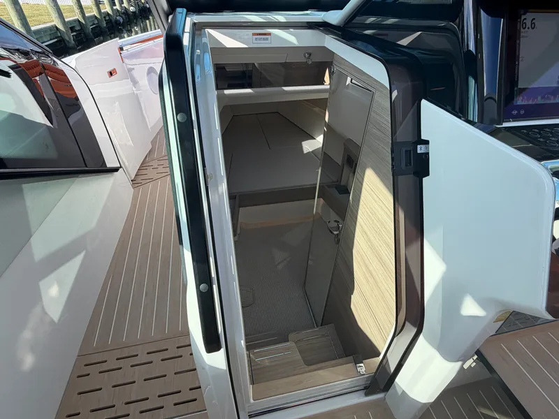 Slide: The Image of The 2027 Saxdor 400 GTC features a modern interior with wood paneling and stairs. - 33