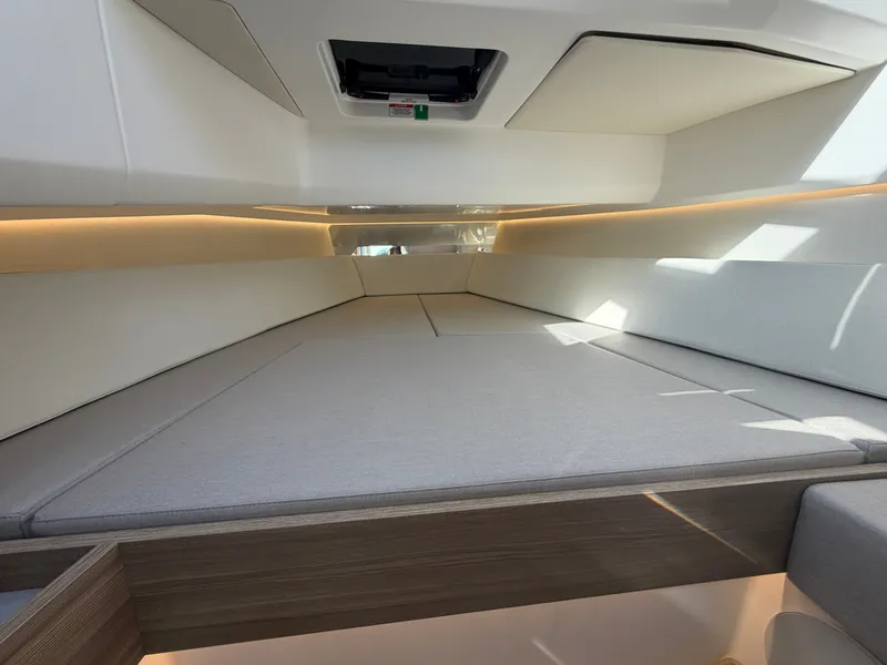Slide: The Image of Interior of a 2027 Saxdor 400 GTC with sleek upholstery and wood paneling. - 36