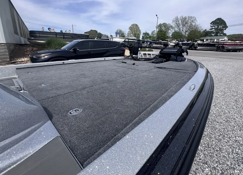 Slide: The Image of 2024 Falcon F205 boat with spacious deck on gravel lot. - 7