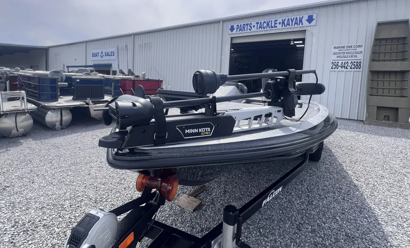 Slide: The Image of 2024 Falcon F205 boat parked outside a sales shop. - 8