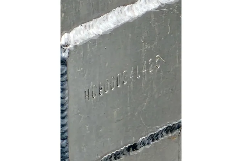Slide: The Image of Close-up of a 2025 Houseboat float house hull with serial number. - 22