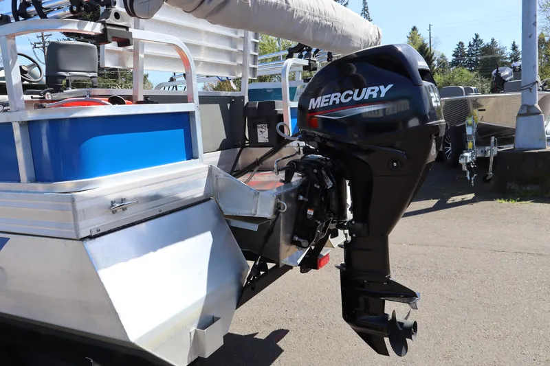 Slide: The Image of 2020 Ag Dryer Laker Pontoon with Mercury outboard motor, parked outdoors. - 3