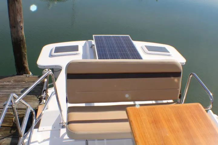 Slide: The Image of 2019 Ranger Tugs R-31 CB boat with solar panel and seating area. - 11