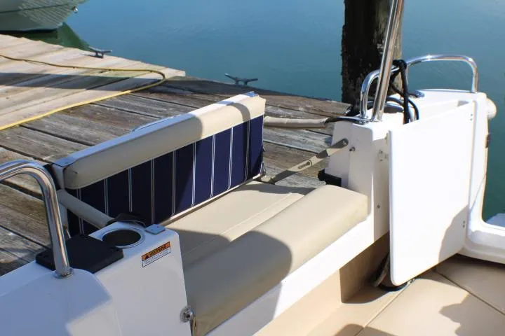 Slide: The Image of 2019 Ranger Tugs R-31 CB boat seating area by the dock. - 21