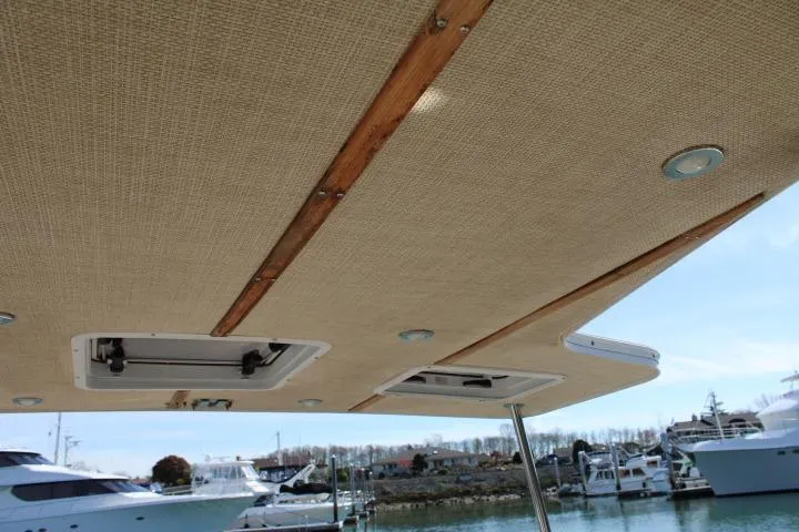 Slide: The Image of 2019 Ranger Tugs R-31 CB boat canopy with hatches, docked in marina. - 25