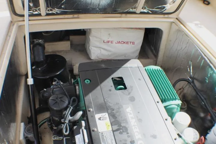 Slide: The Image of Engine compartment of 2019 Ranger Tugs R-31 CB with life jackets stored inside. - 30