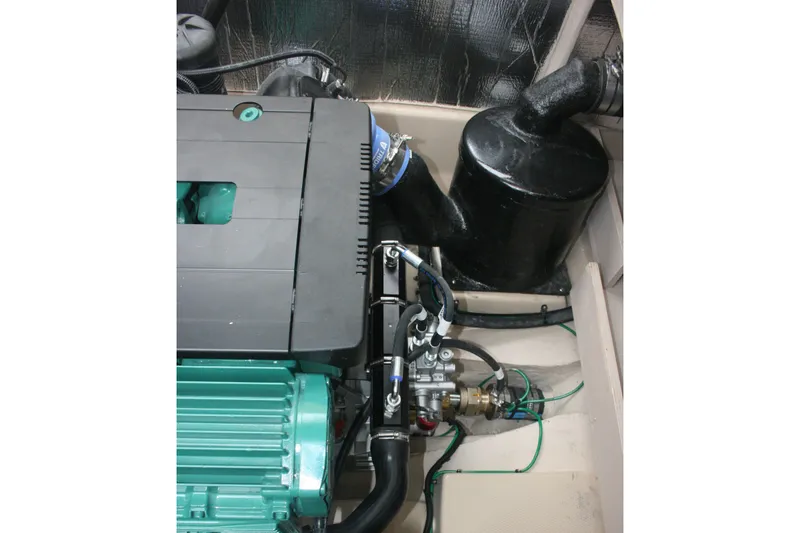 Slide: The Image of Engine compartment of 2019 Ranger Tugs R-31 CB boat, showcasing mechanical components. - 31
