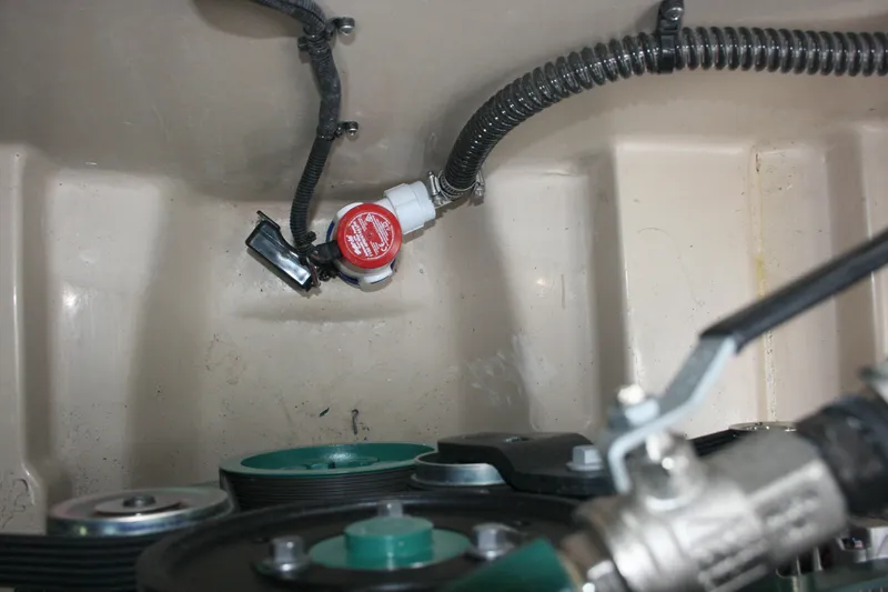 Slide: The Image of Engine compartment of 2019 Ranger Tugs R-31 CB with visible wiring and components. - 34