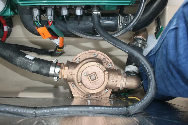 Slide: The Image of Engine compartment of 2019 Ranger Tugs R-31 CB with visible hoses and components. - 35