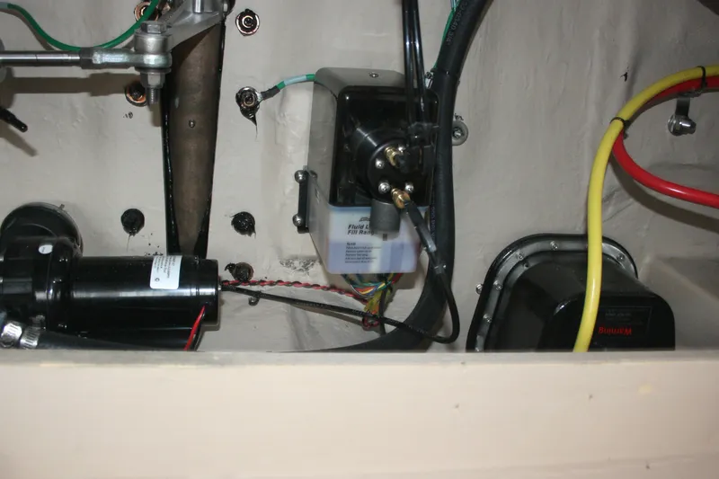 Slide: The Image of Engine compartment of 2019 Ranger Tugs R-31 CB with wiring and components visible. - 38