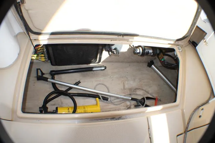 Slide: The Image of Storage compartment of 2019 Ranger Tugs R-31 CB with tools and equipment. - 39