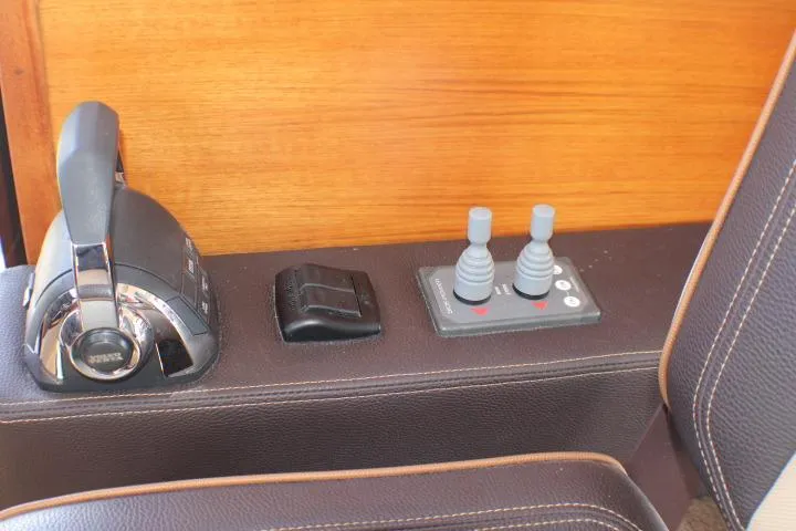 Slide: The Image of Control panel of 2019 Ranger Tugs R-31 CB with throttle and joystick controls. - 47