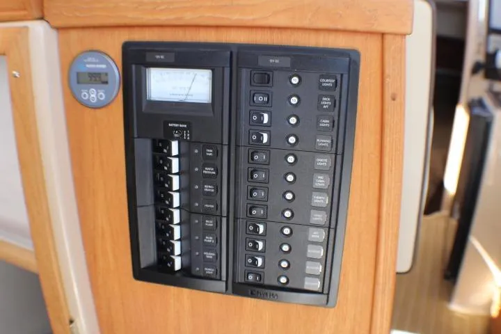 Slide: The Image of Electrical panel on 2019 Ranger Tugs R-31 CB boat, featuring switches and controls. - 48