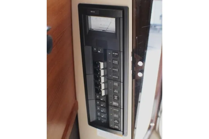 Slide: The Image of Electrical panel on 2019 Ranger Tugs R-31 CB boat, featuring switches and controls. - 49