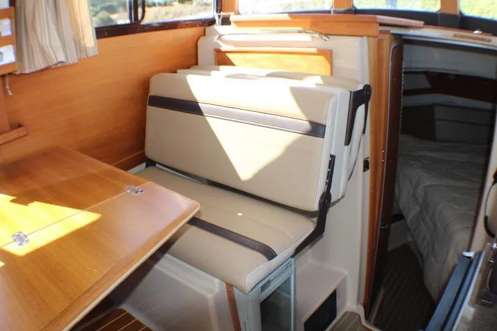 Slide: The Image of Interior of 2019 Ranger Tugs R-31 CB with seating and table. - 53