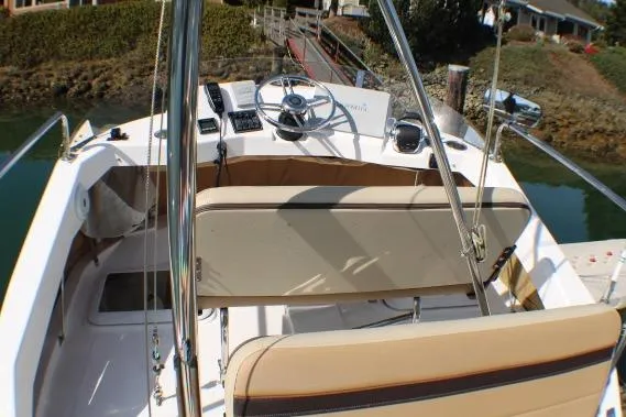 Slide: The Image of 2019 Ranger Tugs R-31 CB boat cockpit with steering wheel and seating. - 6