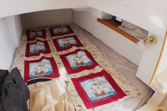 Slide: The Image of 2019 Ranger Tugs R-31 CB cabin interior with nautical-themed quilt. - 70