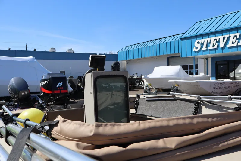 Slide: The Image of 2002 Alumaweld SUPER VEE LS boat with Mercury engine at dealership, sunny day. - 11