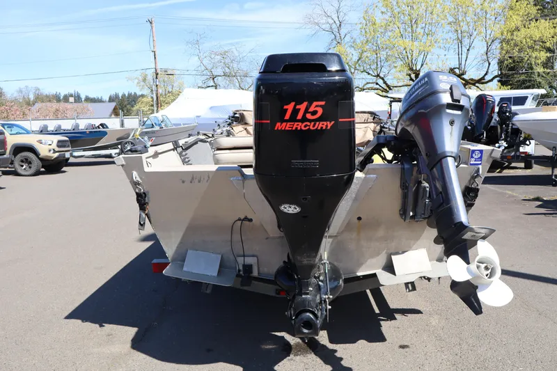 Slide: The Image of 2002 Alumaweld SUPER VEE LS boat with Mercury 115 outboard motor in parking lot. - 5