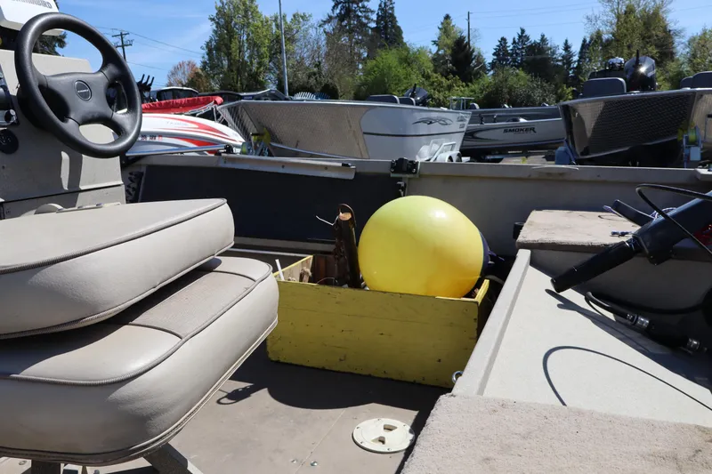 Slide: The Image of Interior of a 2002 Alumaweld SUPER VEE LS boat with steering wheel and yellow buoy. - 8