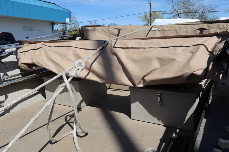 Slide: The Image of 2002 Alumaweld SUPER VEE LS boat interior with covered equipment and storage compartments. - 9