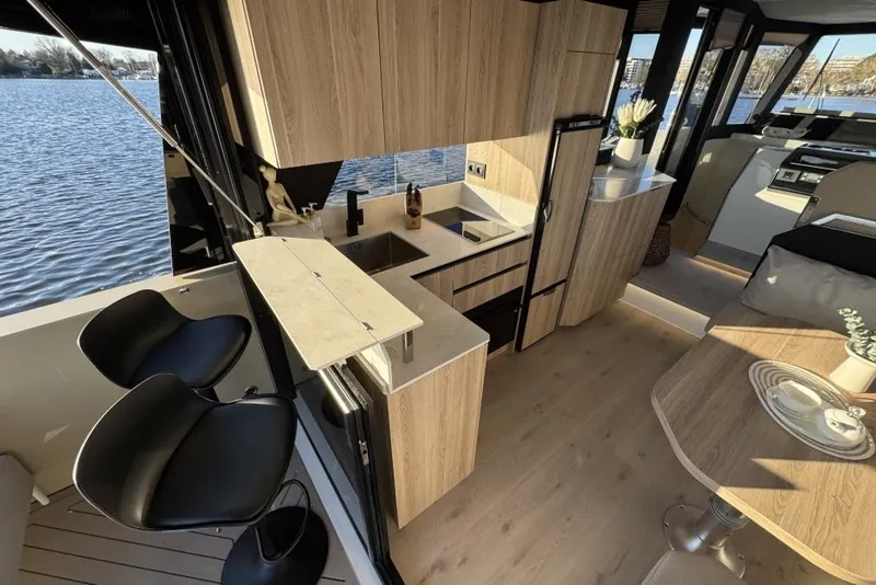 Slide: The Image of Modern interior of 2026 Cobra Yachts Campione 41 Coupe with sleek kitchen and dining area. - 11