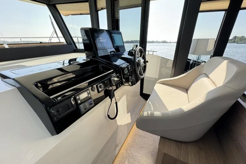 Slide: The Image of Luxurious interior of 2026 Cobra Yachts Campione 41 Coupe with modern helm and plush seating. - 12